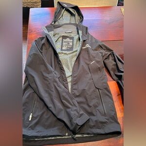 Woman’s Kathmandu (a New Zealand brand) hooded rain jacket.  Size Small